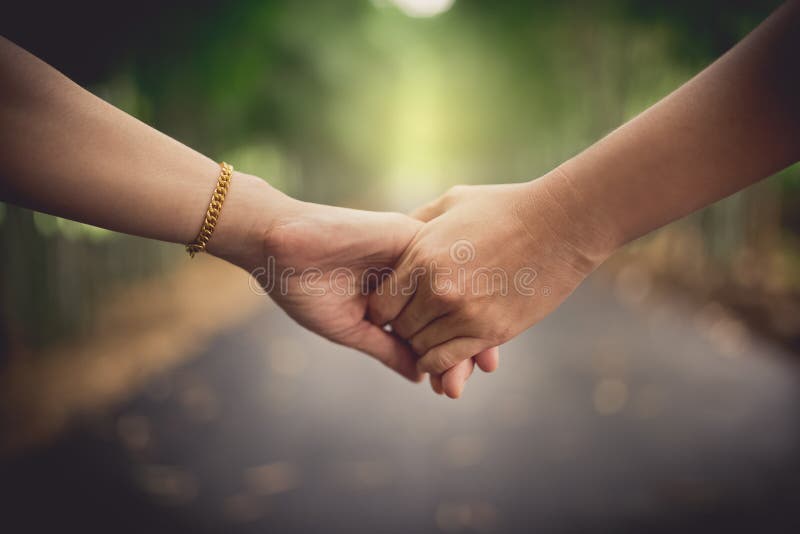 Closeup women`s hands holding together stock photo Closeup women`s hands holding together stock photo