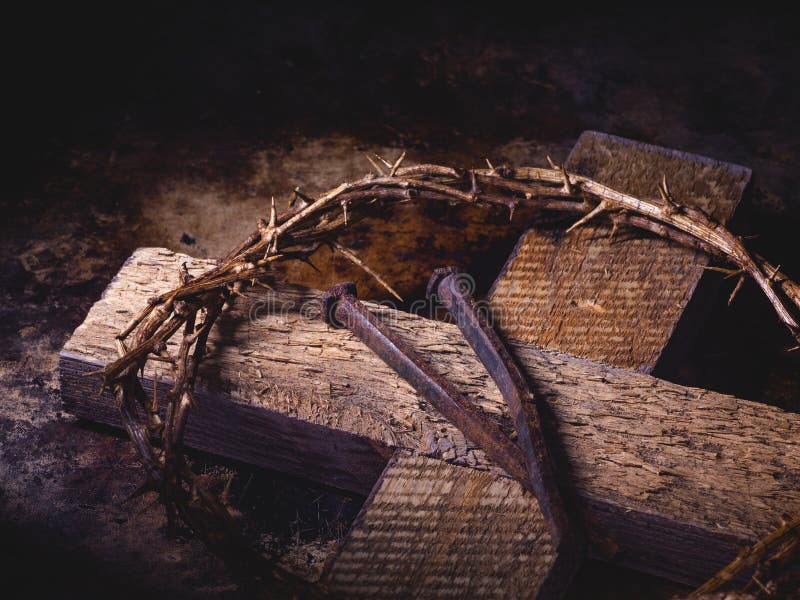 Closeup of a Wooden Cross, Crown of Thorns and Nails