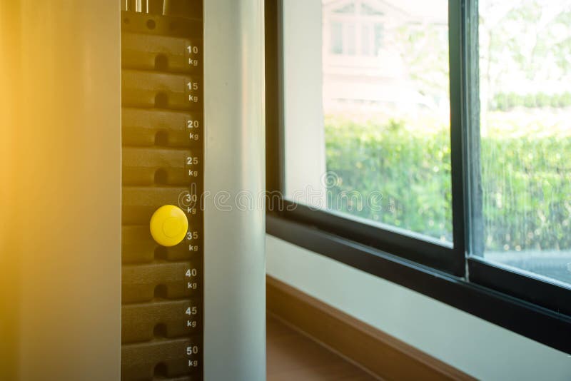 Yellow pin on stack metal weights. stock image
