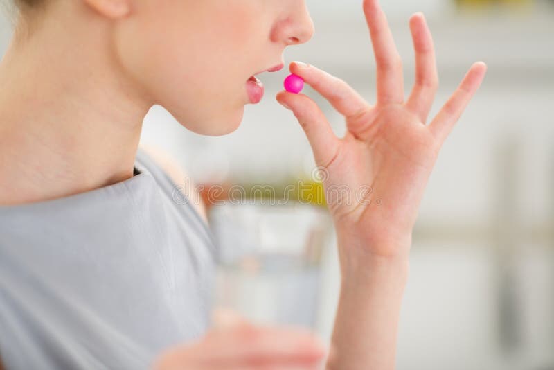 Closeup on Young Housewife Eating Pill Stock Photo Image of eating