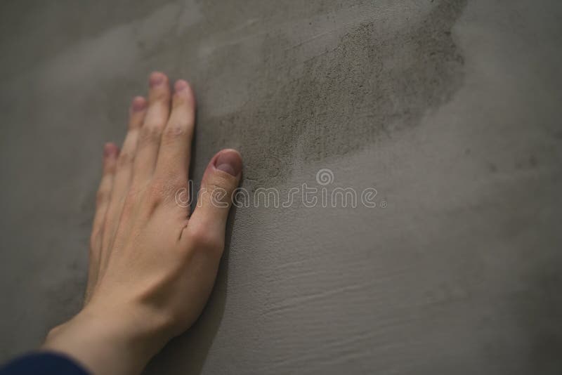 Young Man Hand Touching Concrete Wall Stock Photos Free & Royalty