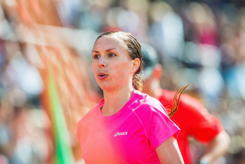 Closeup of a young womans face with blurred background at the final stretch at Stockholm Stadion stock photo Closeup of a young womans face with blurred background at the final stretch at Stockholm Stadion stock photo