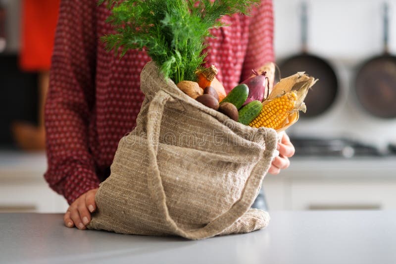 A burlap sac is bursting forth with a selection of autumn vegetables, including corn, cucumbers, onions, and carrots. The possibilities are endless. A burlap sac is bursting forth with a selection of autumn vegetables, including corn, cucumbers, onions, and carrots. The possibilities are endless...