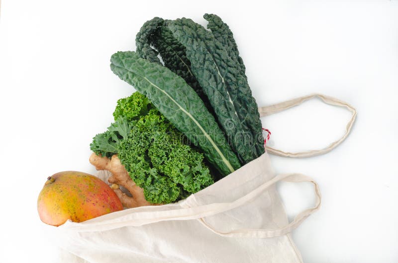 Cloth Bag with Fresh Vegetables on White Background. Top View Stock