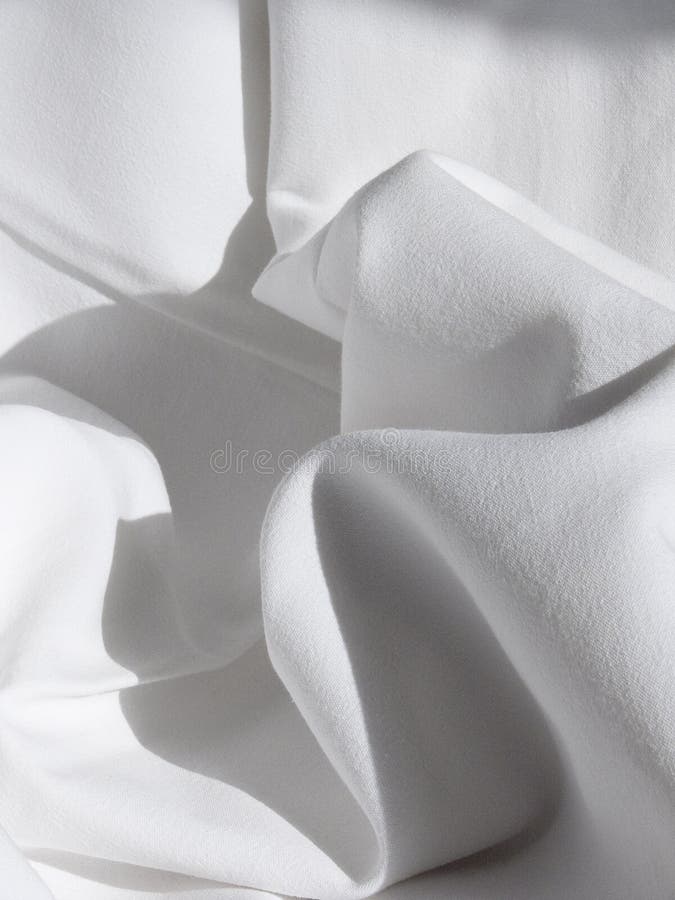 Cloth, Drape with Folds Closeup of a Beautiful White Bed Sheet Stock