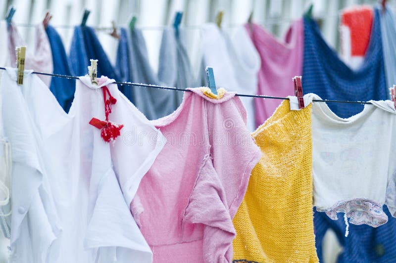 Clothes on clotheslines stock photos