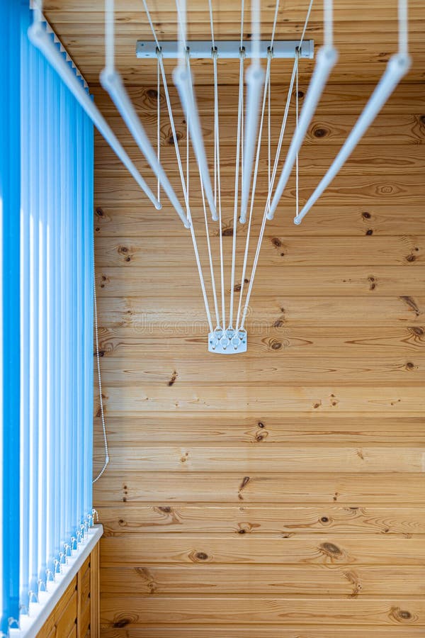 Clothes Dryer Attached To the Ceiling with Clothes Hanging Stock Image