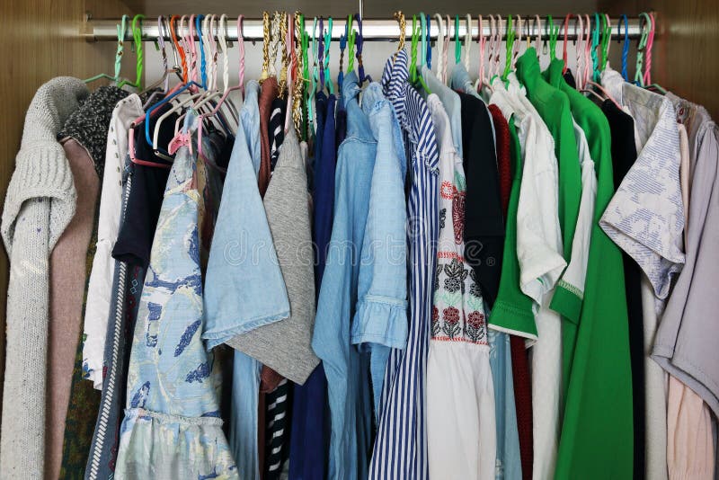Clothes hang in closet stock photo. Image of cloth, coat 93713456