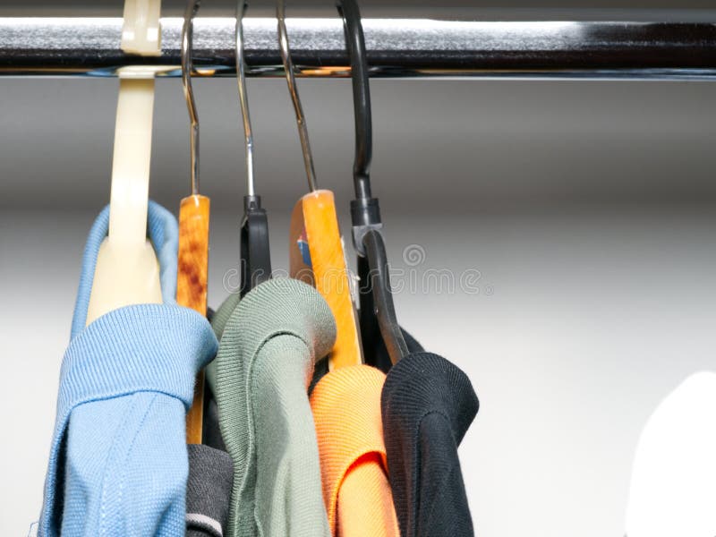 Clothes Hang on Hangers Inside the Closet. Close Stock Photo Image of