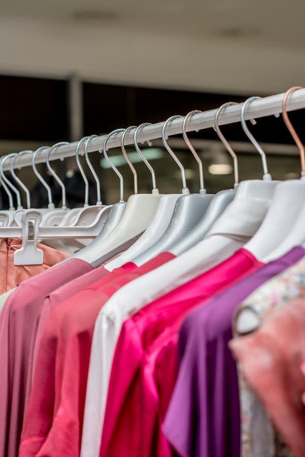 Clothes Hang on a Shelf in a Clothes Store Stock Photo Image of