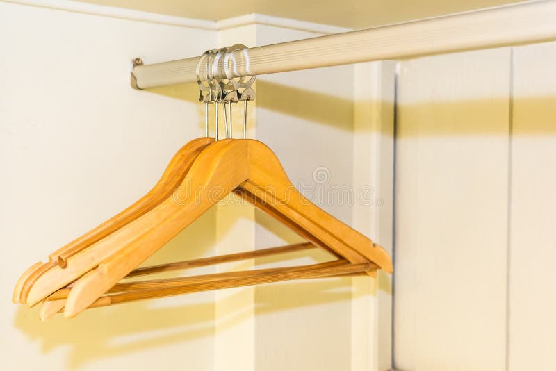 Clothes hanger in closet stock image. Image of fabric 142818621