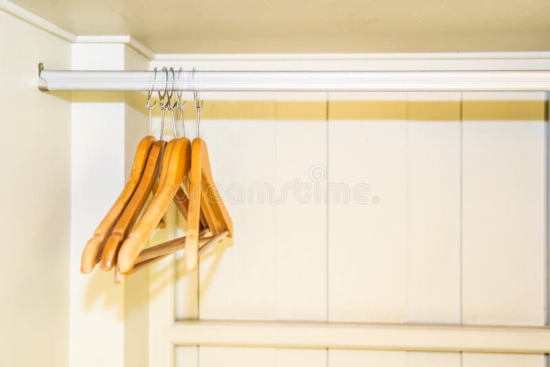 Clothes hanger in closet stock image. Image of store 145780445