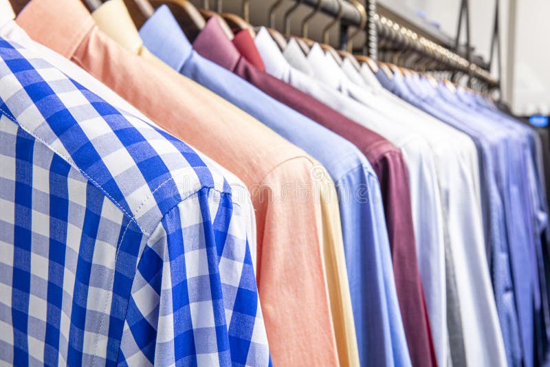 Shirt on Hangers Fashion Store in in the Shopping Mall.soft Focus Effect  Stock Image - Image of color, hanger: 182786345