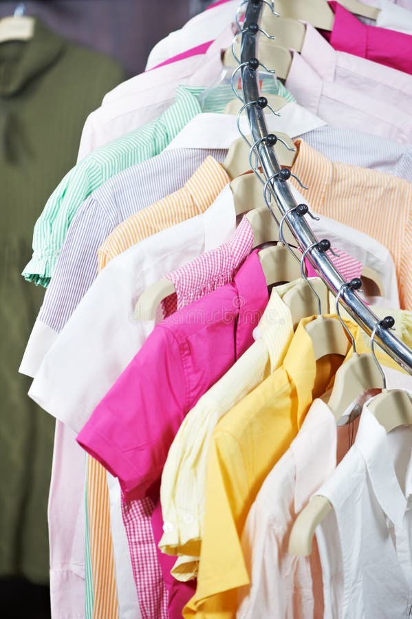 Clothes on hanger in shop stock image. Image of rack 23863191