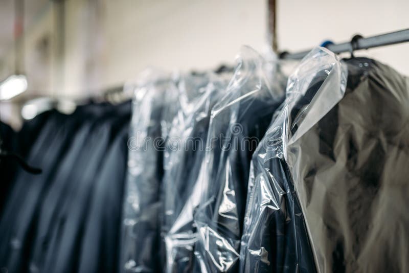 Clothes on hangers, sewing factory or dress fabric royalty free stock photography Clothes on hangers, sewing factory or dress fabric royalty free stock photography