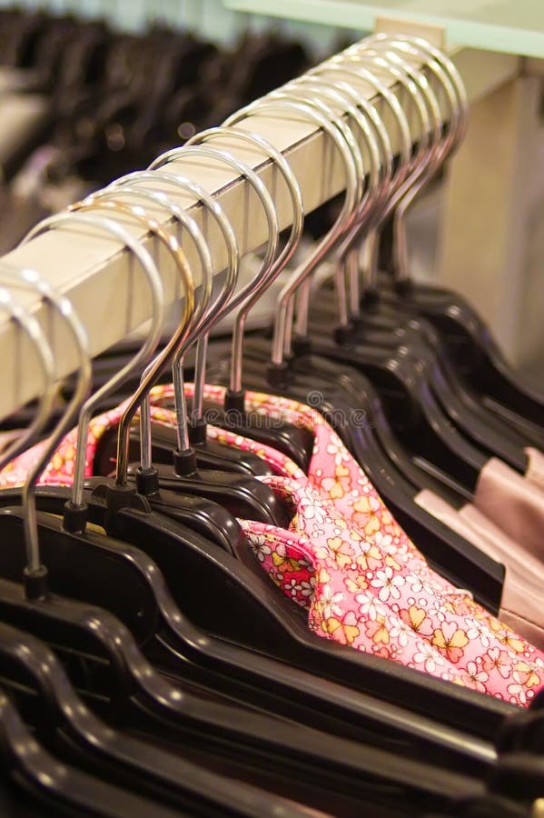 Clothes hangers in a shop stock photo. Image of hanger 9642622