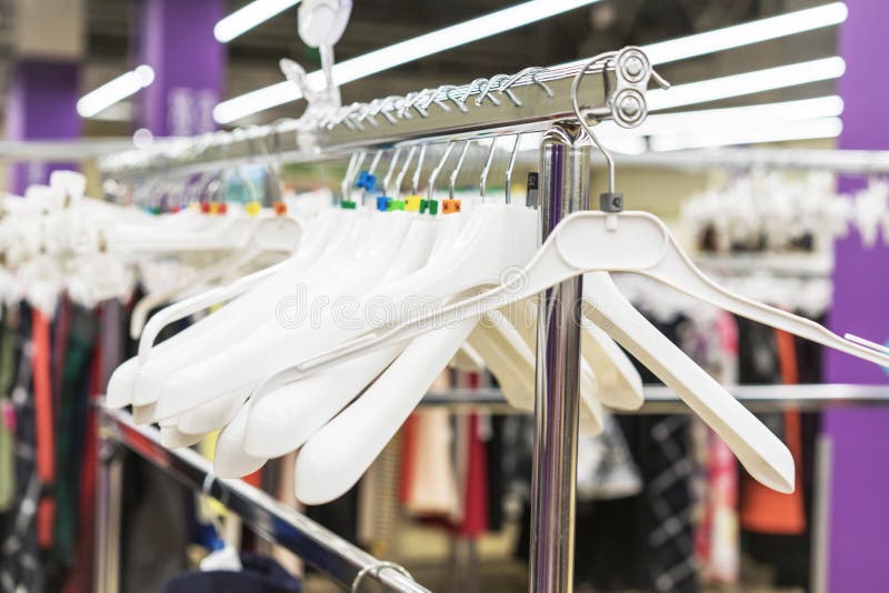 Clothes Hangers in the Store. Clothes Store Concept Stock Image - Image ...