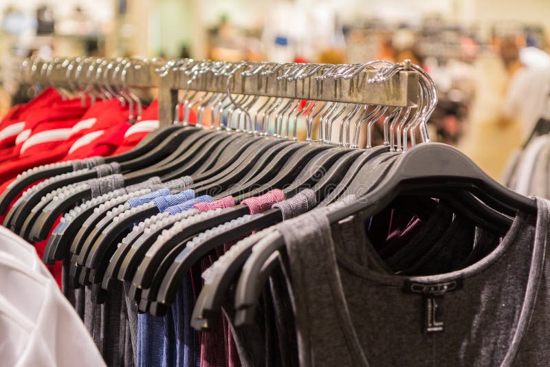 Clothes on rack in mall stock photo. Image of life, person - 6582798