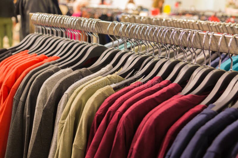 Clothes Hanging on a Rack in a Shopping Mall. Stock Photo Image of