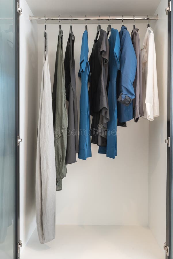 Clothes hanging on rail stock photo. Image of sideways - 119108424