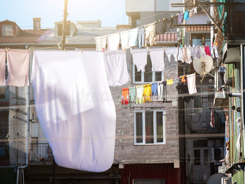 Clothes Hanging To Dry on Clothesline Outdoors Inside Yard of Houses.  Drying Washed Laundry in Georgia Stock Photo - Image of background, drying:  269478820