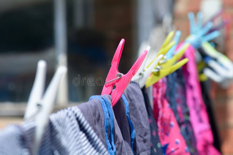Clothes Pegs and Clothes on Washing Line Stock Photo Image of pegs