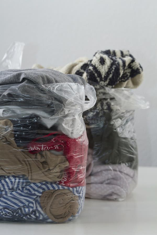 Clothes in plastic bags stock photo. Image of donation 179130506