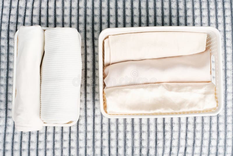 Clothes in Plastic Containers Top View, Space Organization Concept