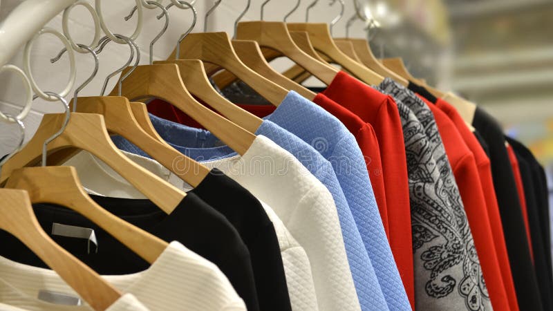 Interior view of a fashion shop,Hongkong,China,Asia. female clothes on racks. Interior view of a fashion shop,Hongkong,China,Asia. female clothes on racks