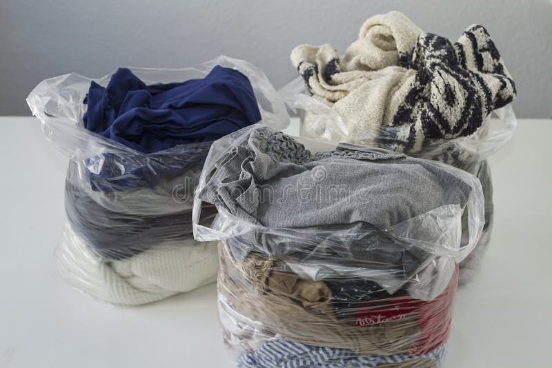 Clothes in plastic bags stock photo. Image of fabric 179130700