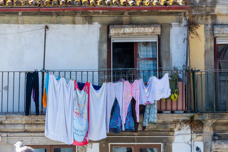 Clotheslines for Dry Clothes Outside a Windows in an Old Town