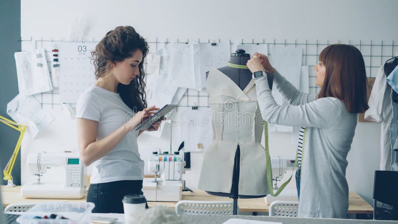 Clothing Designer Entrepreneurs are Measuring Mannequin Parts while ...