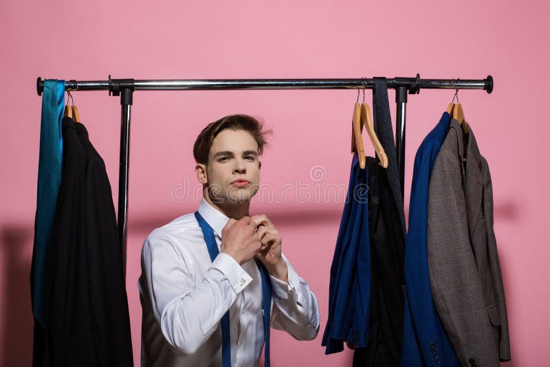 Wardrobe With Complementary Colors Orange And Blue Clothes Arranged On  Hangers. Dressing Closet With Clothes, Shoes And Accessories And A Dress On  A Mannequin. Stock Photo, Picture and Royalty Free Image. Image