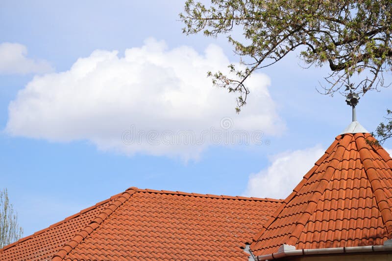 Cloud over the roof of a house royalty free stock images