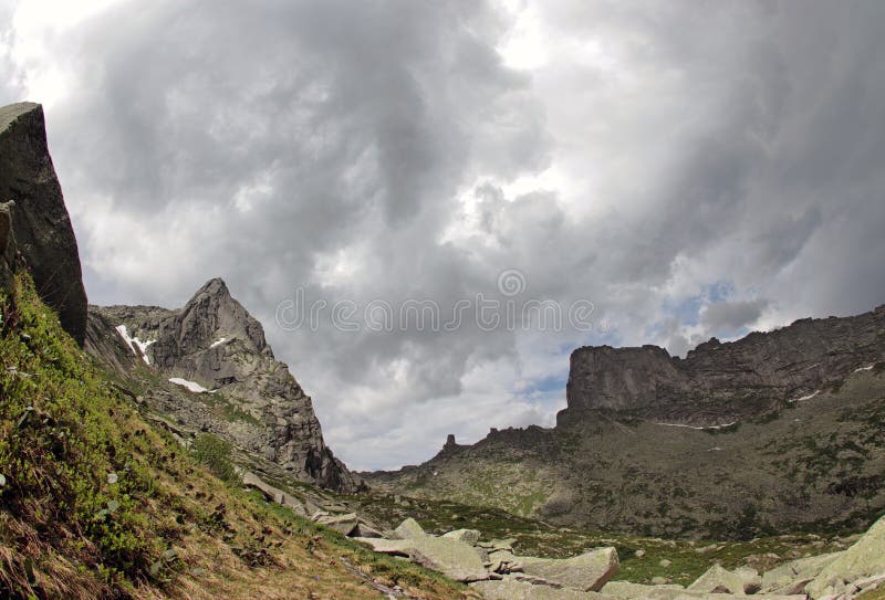 Clouds above mountain peaks. Natural Park Ergaki, Russia. stock photo Clouds above mountain peaks. Natural Park Ergaki, Russia. stock photo
