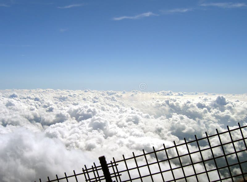 Clouds behind a fence royalty free stock photo Clouds behind a fence royalty free stock photo