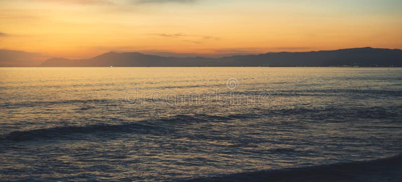 Clouds blue sky and gold sunlight sunset on horizon ocean, background seascape dramatic atmosphere rays sunrise. Relax view waves stock photos Clouds blue sky and gold sunlight sunset on horizon ocean, background seascape dramatic atmosphere rays sunrise. Relax view waves stock photos