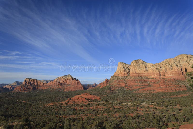 Rock formation in Sedona, AZ with unique clouds overhead. Rock formation in Sedona, AZ with unique clouds overhead