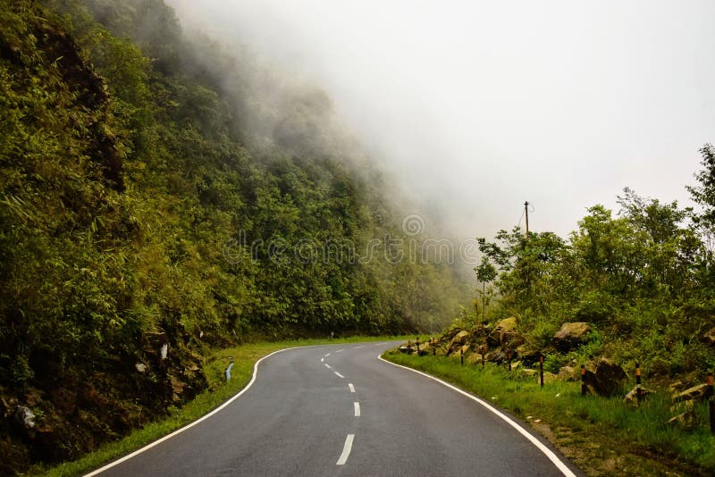 Clouds passing through the high plateau road of cherrapunjee meghalaya india royalty free stock photography
