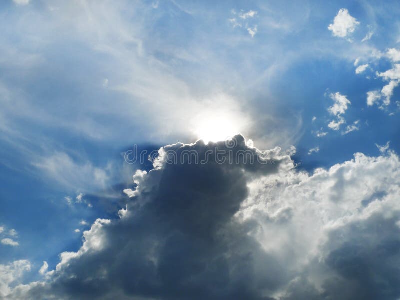 Clouds, silver lining with sunbeams, rising storm clouds stock photos Clouds, silver lining with sunbeams, rising storm clouds stock photos