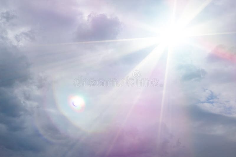 The clouds in the sky.   Graphic storm clouds  background with bright ray of sunlight and bokeh lights.