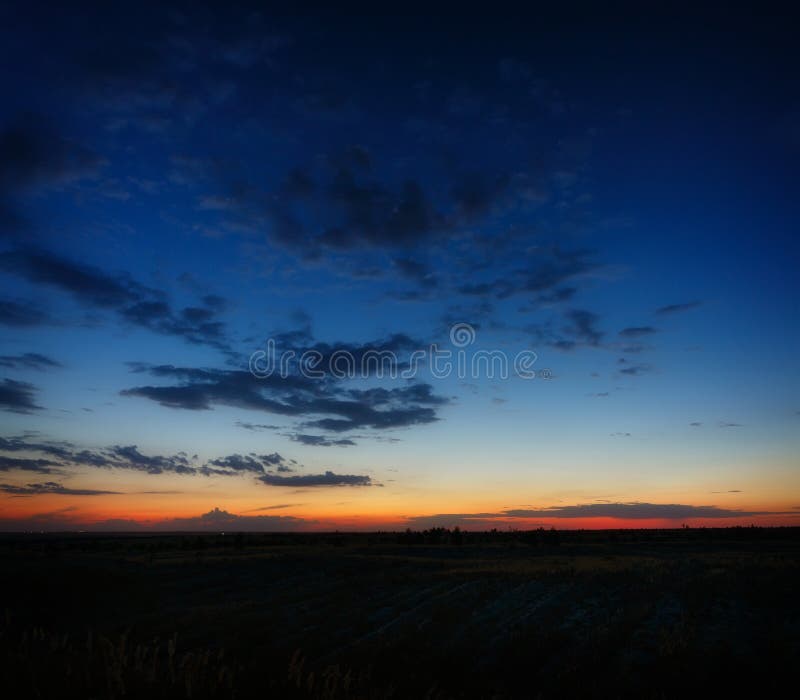 Clouds in the Sky after Sunset. Evening Twilight in Summer Stock Photo