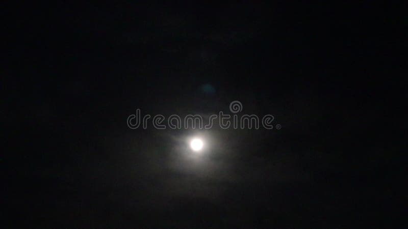 Clouds time lapse in night with moon light