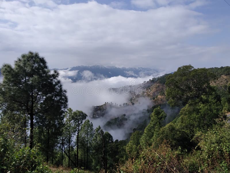 Clouds trapped within mountain royalty free stock photos