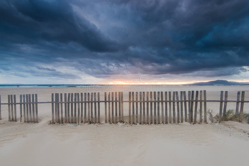 Cloudscape over beach and ocean in Spain, before storm