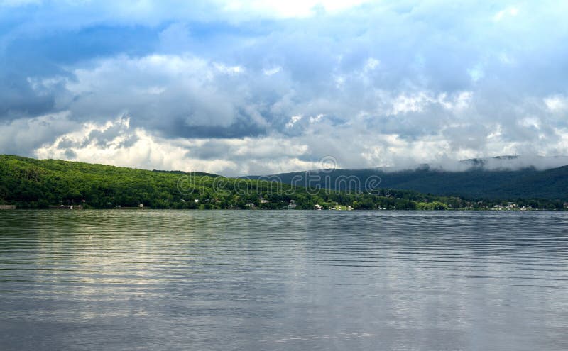 Cloudscape over lake royalty free stock photos