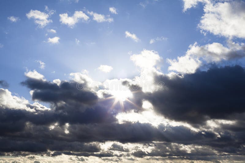 Cloudscape with the Sun Behind the Clouds Stock Photo Image of