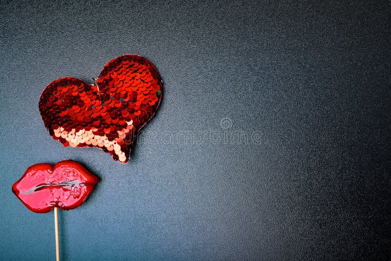clouse up of red heart, lips on black background, Valentine, weeding day, love concept