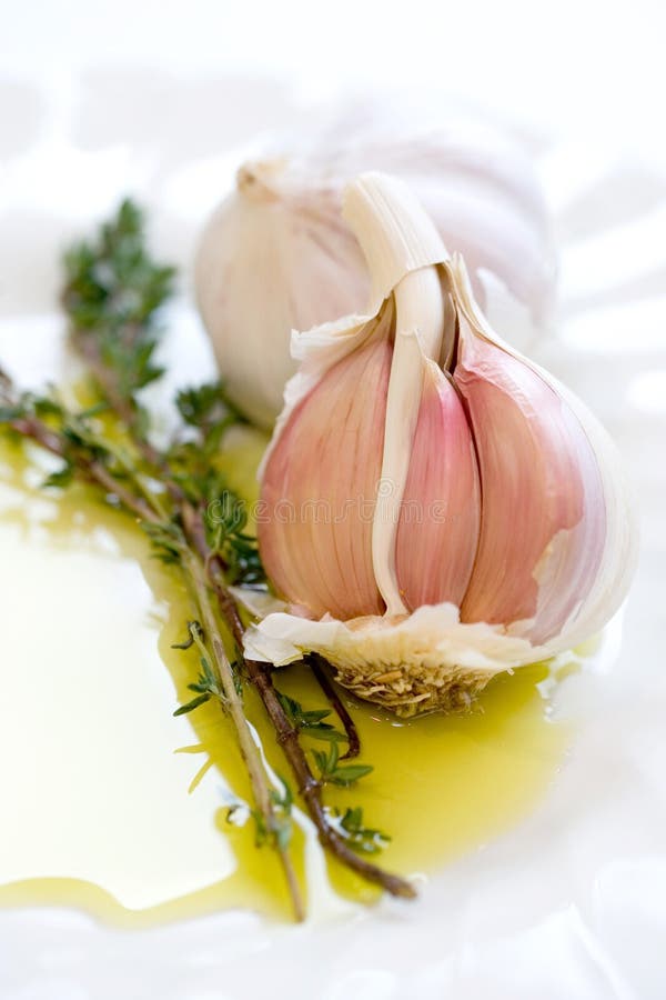 Cloves of garlic and sprig of fresh thyme