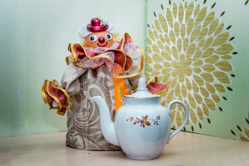 https://thumbs.dreamstime.com/b/clown-beautiful-warmer-teapot-textiles-jewelry-creative-handmade-beautiful-background-clown-warmer-111596446.jpg